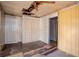Bedroom showcasing a damaged ceiling, dated wallpaper and trim, closet and doorways at 1520 S Michigan Ave, Clearwater, FL 33756