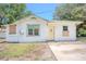 An exterior front view of the house with some grass at 1520 S Michigan Ave, Clearwater, FL 33756