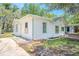 An exterior view of the side of the home with partial grass at 1520 S Michigan Ave, Clearwater, FL 33756