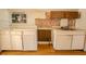 Kitchen with outdated cabinets and appliances; in need of renovation at 1520 S Michigan Ave, Clearwater, FL 33756