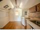 Small kitchen features limited cabinet space, white appliances, and natural light at 1520 S Michigan Ave, Clearwater, FL 33756