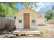 Rustic outbuilding with a sturdy door and small windows, showcasing its potential for various uses at 1520 S Michigan Ave, Clearwater, FL 33756