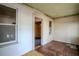 Enclosed porch featuring multiple windows, original woodwork and an open doorway to another room at 1520 S Michigan Ave, Clearwater, FL 33756