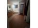 The bathroom features a double sink vanity, bathtub with shower and neutral color palette at 1521 Atami Ct, Wesley Chapel, FL 33544
