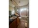 Bathroom with vanity, toilet, shower, and tub combination at 1521 Atami Ct, Wesley Chapel, FL 33544