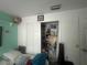 Small bedroom closet with bi-fold doors and storage space at 1521 Atami Ct, Wesley Chapel, FL 33544
