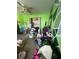 Bedroom with bright green walls, closet and many personal items at 1521 Atami Ct, Wesley Chapel, FL 33544