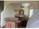 Spacious dining room featuring hardwood floors, an archway, and a ceiling fan at 1521 Atami Ct, Wesley Chapel, FL 33544