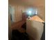 View of a hallway with hardwood floors and multiple doorways at 1521 Atami Ct, Wesley Chapel, FL 33544