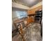 The kitchen features stainless steel appliances, light colored wood cabinets and large sink at 1521 Atami Ct, Wesley Chapel, FL 33544