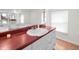 Bathroom featuring bright red countertop at 15711 Springmoss Ln, Tampa, FL 33624