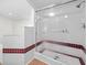 Bathroom featuring glass enclosed shower with built in bench at 15711 Springmoss Ln, Tampa, FL 33624