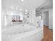 Bathroom featuring large bathtub with tile surround and jets at 15711 Springmoss Ln, Tampa, FL 33624