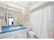 Bathroom featuring large mirror and shower with white floral curtain at 15711 Springmoss Ln, Tampa, FL 33624