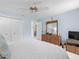 Bedroom featuring large closet and wood dresser at 15711 Springmoss Ln, Tampa, FL 33624