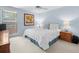 Bedroom featuring comfortable bed and bright sunlight at 15711 Springmoss Ln, Tampa, FL 33624