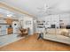 Open concept living area with kitchen, dining, and built-in shelving at 15711 Springmoss Ln, Tampa, FL 33624