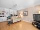 Cozy living room features built-in shelving, wood-paneled walls, and comfortable seating at 15711 Springmoss Ln, Tampa, FL 33624