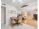 Eat-in kitchen flows into the living room with built-in shelving for cozy Gathering gatherings at 15711 Springmoss Ln, Tampa, FL 33624