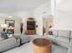Cozy living room with a large sectional, media center, and access to a stairway at 15711 Springmoss Ln, Tampa, FL 33624