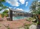 Enjoy this home's screened-in pool and backyard perfect for outdoor entertaining and relaxation at 15711 Springmoss Ln, Tampa, FL 33624