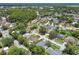 Neighborhood aerial view showing properties, mature trees, and community layout at 15722 Gardenside Ln, Tampa, FL 33624