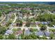 Neighborhood aerial view showing properties, mature trees, and community layout at 15722 Gardenside Ln, Tampa, FL 33624