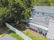 Well-maintained backyard featuring a screened-in lanai and covered area for a relaxing outdoor experience at 15722 Gardenside Ln, Tampa, FL 33624