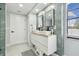 Stylish bathroom featuring double sinks, ample counter space, and sleek fixtures at 15722 Gardenside Ln, Tampa, FL 33624