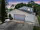 Charming two-story home featuring an attached two car garage and a beautiful landscaped front yard at 15722 Gardenside Ln, Tampa, FL 33624