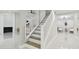Open and bright staircase with white railings and modern design elements at 15722 Gardenside Ln, Tampa, FL 33624