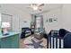 Adorable Bedroom with crib, changing table, and custom wall art at 1827 Trillium Blvd, Brooksville, FL 34604