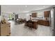 Open concept kitchen with granite countertops, stainless steel appliances and a large island at 1827 Trillium Blvd, Brooksville, FL 34604