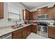 Well-equipped kitchen featuring granite countertops, stainless steel appliances, and abundant storage at 1827 Trillium Blvd, Brooksville, FL 34604