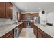 Beautiful kitchen with granite countertops, stainless steel appliances and wooden cabinetry at 1827 Trillium Blvd, Brooksville, FL 34604