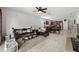 Spacious open-concept living area with tile flooring and seamless flow into the kitchen and dining area at 1827 Trillium Blvd, Brooksville, FL 34604