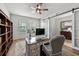 Office featuring a large desk and chair, with an adjacent seating area at 1827 Trillium Blvd, Brooksville, FL 34604