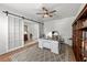 Office with sliding glass barn doors, hardwood floors, desk, and built-in shelving at 1827 Trillium Blvd, Brooksville, FL 34604