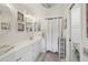 Updated bathroom with vanity, decorative mirrors, new lighting, and a shower/tub combo at 1830 Cypress Trace Dr, Safety Harbor, FL 34695