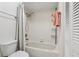 Clean bathroom featuring a standard shower/tub combo with a white shower curtain at 1830 Cypress Trace Dr, Safety Harbor, FL 34695