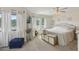 Bright bedroom with large windows, soft drapes, and stylish furniture at 1830 Cypress Trace Dr, Safety Harbor, FL 34695