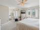 Bright bedroom with large windows, soft drapes, and stylish furniture at 1830 Cypress Trace Dr, Safety Harbor, FL 34695