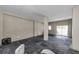 Finished basement area with concrete floors, columns, and natural light at 19111 Whispering Pines Dr, Indian Shores, FL 33785