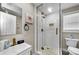 Modern bathroom featuring a glass-enclosed shower, stylish vanity, and contemporary finishes at 19111 Whispering Pines Dr, Indian Shores, FL 33785