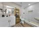 Modern bathroom featuring a glass-enclosed shower, stylish vanity, and contemporary finishes at 19111 Whispering Pines Dr, Indian Shores, FL 33785