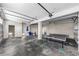 Spacious garage with concrete floors, a ping pong table, and room for storage or hobbies at 19111 Whispering Pines Dr, Indian Shores, FL 33785