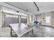 Large garage featuring multiple car doors, ample storage, and a ping pong table for recreation at 19111 Whispering Pines Dr, Indian Shores, FL 33785