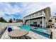 Beautiful backyard pool area with a spa, outdoor seating, and a spacious deck at 19111 Whispering Pines Dr, Indian Shores, FL 33785