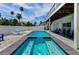 Stunning pool and spa featuring stylish lounge chairs and inviting ambiance at 19111 Whispering Pines Dr, Indian Shores, FL 33785