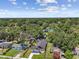Panoramic aerial view featuring property amidst lush green surroundings, showcasing the neighborhood and cityscape at 1914 E Chelsea St, Tampa, FL 33610
